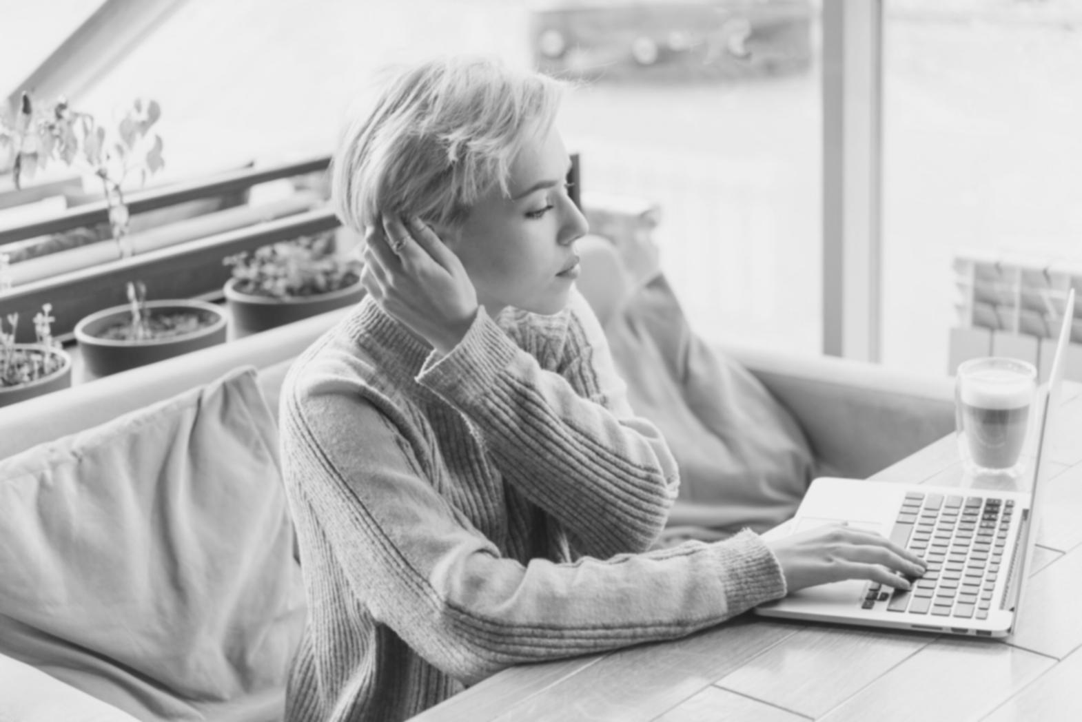 Person analyzing their monthly expenses on laptop